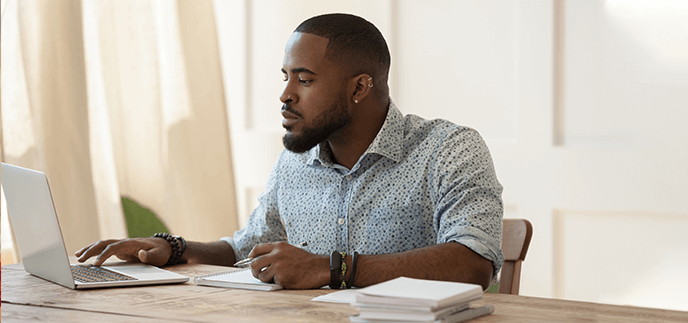 Young man choosing the right loan and applying online